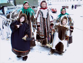 Komi reindeer breeders, siberia, russia, 11/02, komi women who live in a subpolar region wearing sweaters made of reindeer fur which is a traditional outer clothing of tundra women, children display c...