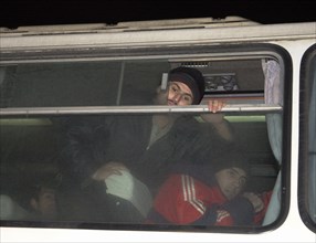 Moscow, russia, november 15 2002: tajik illegal immigrants (in pic) in a bus prior to their departure for chkalovsky airport for further deportation, the people's courts of khimki and podolsk district...