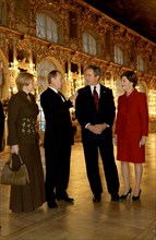 Leningrad region, russia, november 22 2002: president of russia vladimir putin (2nd l) and president of the usa george bush (2nd r) and their wives lyudmila (l) and laura (r) in one of the halls of th...