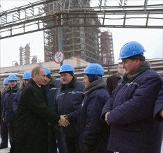 Ryazan region, russia, november 29 2002 , president vladimir putin (l) pictured being welcomed by workers of the ryazan oil refinery he visited during his one-day trip to ryazan region,on friday, (pho...