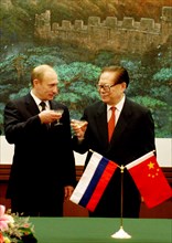 Beijing, china, december 2 2002: president of russia vladimir putin (left) and chairman of the people's republic of china jiang zemin(right) toast after the talks at the national congress centre, mond...