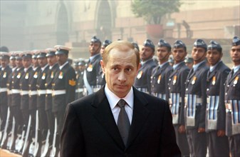 India, december 4 2002: president of russia vladimir putin (in pic) inspects the guard of honour in front of the presidential palace at the beginning of his official visit to india.