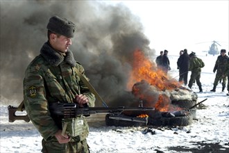 Tajikistan, december 6 2002: men of the moskovsky border detachment burning up packets containing the confiscated drugs with a total weight of 841,9 kilograms, on friday, the drugs were confiscated in...