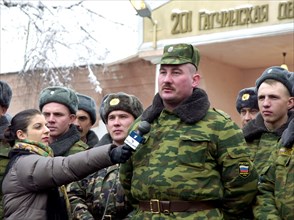 Oleg kozlov, a warrant officer of the 201st russian motorized division stationed in tajikistan pictured asking president vladimir putin a question during his live dialogue with russian people broadcas...