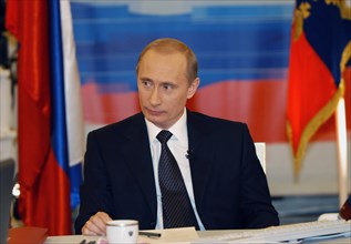 Moscow, russia, december 19, 2002, russian president vladimir putin pictured during his live tv- and radio dialogue with russians, the dialogue was broadcast live by the first tv channel, the russia t...