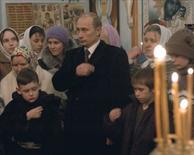 Russian president vladimir putin attending a christmas service in the church of the vladimir icon of the mother of god in agapovka township on the night from monday to tuesday, january 7, 2003.