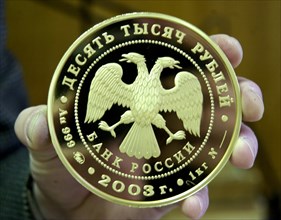 Moscow, russia, january 29 2003, picture shows a memorial gold coin,dedicated to the 300th anniversary of st,petersburg, made at the moscow mint , this enterprise equipped with modern machinery manufa...