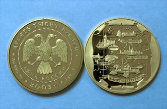 At the moscow mint, moscow, russia, january 29 2003, picture shows a memorial coin,dedicated to the 300th anniversary of st,petersburg, made at the moscow mint, this enterprise equipped with modern ma...