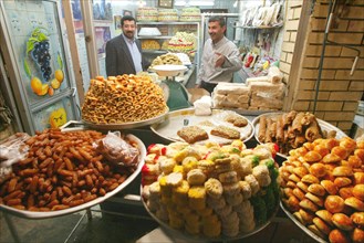 Baghdad, iraq, february 13 2003, a confectioner selling sweets in a baghdad street, (photo itar-tass / vitaly belousov) .