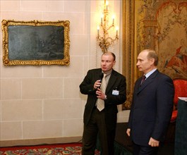 President of russia, vladimir putin (right) and president of the 'interros' company vladimir potanin (left) meeting in a lobby of the 'bristol' hotel, were vladimir putin stayed during his visit to fr...
