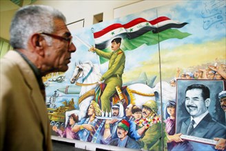 Baghdad, iraq, february 14 2003: exhibition of paintings (in pic) by iraqi artists at the museum of contemporary art of saddam in central baghdad, (photo itar-tass / vitaly belousov) .