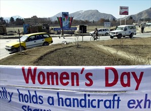 On the eve of march, 8, the central streets of kabul hangs banners calling on inhabitants to visit exhibitions and entertainment to mark international women's day, march 7, 2003, kabul, afghanistan.