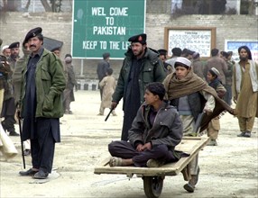 afghanistan, march 17 2003, thousands of people cross daily the border between afghanistan and pakistan through tourkham border crossing point (in pic), there are many families that are still separate...