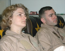 Mediterranean sea, uss theodore roosevelt, march 22, 2003, servicepersons pictured prior to the briefing for pilots, which was held here aboard the aircraft carrier theodore roosevelt before the begin...