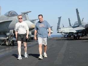 Uss theodore roosevelt aircraft carrier, mediterranean sea, march 25, servicemen on a stroll (in pic) on the flight deck of uss theodore roosevelt lying in the eastern part of the mediterranean sea.