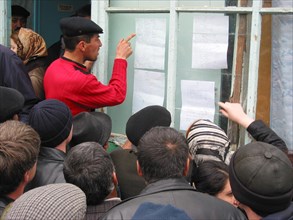 Makhachkala, russia, april 10, 2003, relatives pictured scrutinizing the list of victim of the tragedy happened in a boarding school for deaf and dumb children which was ablazed on thursday having kil...