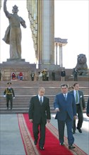 Russian president vladimir putin (l) and tajik president emomali rakhmonov (r) pictured following a wreath laying ceremony at the memorial 'national accord and reconciliation in tajikistan' with the m...
