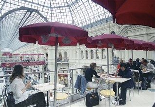 Gum department store marks its 110th anniversary, moscow, russia june 2003, restaurant on balcony.