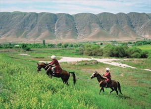 Turkmenia, akhal-teke horses are driven for pasture outside ashkhabad, april 1999.
