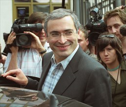 Mikhail khodorkovsky, the head of the yukos oil company and russia's wealthiest man, gets in his car upon leaving the general prosecutor's office