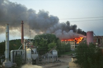 Moscow region, russia, smoke of a burning dump at the asphalt plant in domodedovo, yesterday cloaked the whole town, the ecological situation in moscow suburbs keeps deteriorating, 08,2003.