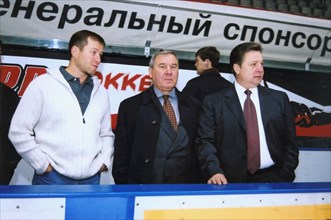 Left to right: governor of chukotka roman abramovich; governor of the omsk region leonid polezhayev, and anatoly bardin, president of the local 'avangard' ice hockey club watch the 'avangard' players ...