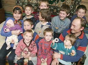 Chuvashia, siberia, russia, october 25 2003, chuvash family living in poverty, mother valentina pours soup for father leonid and their children, there are ten boys in the family, the elder is 13 years...