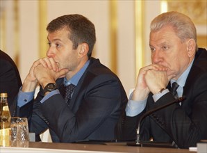 Governor of evenki autonomous area boris zolotaryov (r) and governor of chukot autonomous area roman abramovich (l) at today's sitting of the state council, moscow, russia, october 29, 2003.