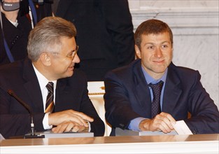 Governor of evenki autonomous area boris zolotaryov (l) and governor of chukot autonomous area roman abramovich (r) at today's sitting of the state council, moscow, russia, october 29, 2003.