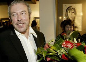 Popular russian singer songwriter andrei makarevich seen at the exhibition 'fifty women of andrei makarevich' which opened at alla bulyanskaya's picture gallery, moscow, russia, december 2003.