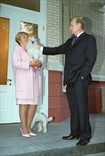 Russian president vladimir putin with his wife lyudmila and their dogs at their residence in novo-ogaryov in the moscow region, september 2, 2002.