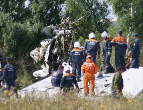 Sorting out the wreckage of tu-134 that crashed in mysterious circumstances on 8/23, tula region, russia, 8/25/04.