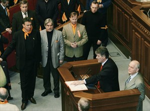 Ukraine election crisis 2004, after a plenary sitting of the supreme rada, opposition leader viktor yushchenko mounted the parliamentary rostrum and declared himself president of ukraine and took a sy...