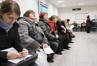 Russian tax payers waiting at moscow tax center, computerized queue system installed at a moscow tax office, january 26th 2005.