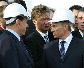 Italian prime minister silvio berlusconi, gazprom chairman alexei miller and russian president vladimir putin get ready to light a symbolic torch for the blue stream undersea gas pipeline which carrie...