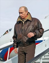 Russian president vladimir putin arrives in the northern caucasus to take part in the first sitting of the newly elected chechen parliament, russia, december 2005.