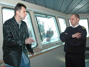 Mikhail prokhorov, the director general of the norilsk nickel jsc, and captain vladimir gusarevich (l-r) are pictured on board the ice class container ship “norilsk nickel”, the first vessel in the co...