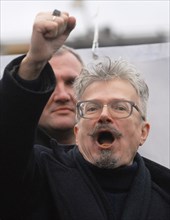 National bolshevik party (nbp) leader eduard limonov raises his fist as he shouts during an opposition protest rally dubbed the 'march of those who disagree' in triumfalnaya square, december 18, 2006,...