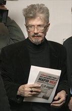 Leader of the national bolshevik party (nbp) eduard limonov holds papers before the other russia political forum attended by russian opposition figures, march 2, 2007, st, petersburg, russia.