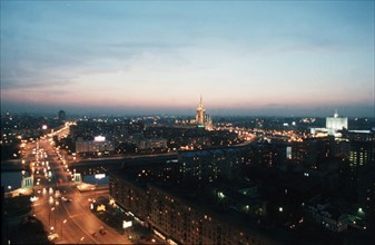 Moscow skyline in early evening around midsummer, 2000, smolenskaya and bolshaya dorogamiloskaya streets, right: ukraine hotel.