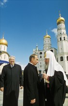 Russian president vladimir putin in cathedral sq inside the kremlin on the day of his inauguration, may 7, 2000, with him are all russia patriarch alexi ll and boris yeltsin.
