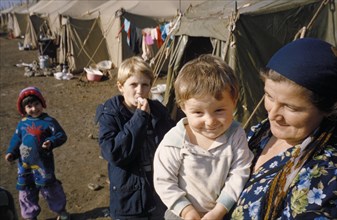 Refugee family at a camp in ingushetia during the war in chechnya, 1999.