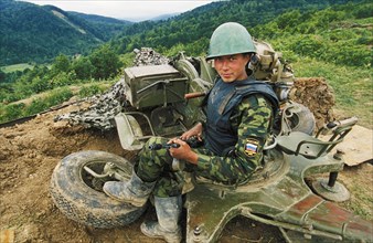 Second chechen war, a russian federation soldier at his post in southern chechnya, june 2000.