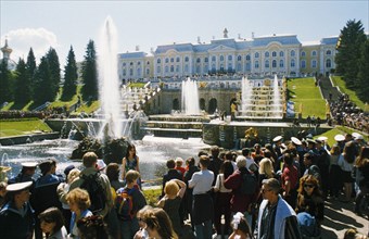 People gathered at the traditional event of turning on the fountains in may at petrodvorets (peterhoff) in st, petersburg, russia.