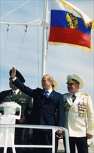 Rf president vladimir putin attending a naval parade in baltiysk, kaliningrad with admiral yegorov of the baltic fleet, russia, august 2000.