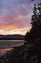 Sunset on the manya river in the ural region of siberia, october 2000.