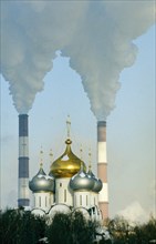 View of the cupolas of the novodevichy convent and the chimneys of the themal electric plant on the berezhkovskaya embankment in the moscow region, january 2002.