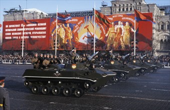 Soviet armored combat vehicles (bmp-76?) in a military parade in red square for the 65th anniversary of the october revolution, 1982.
