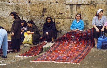 Women selling rugs in daghestan, russia.