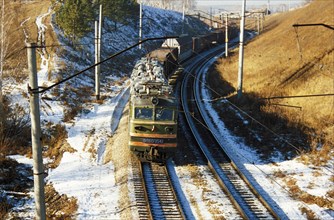 A freight train traveling on the trans-siberian railway in the krasnoyarsk region of russia.